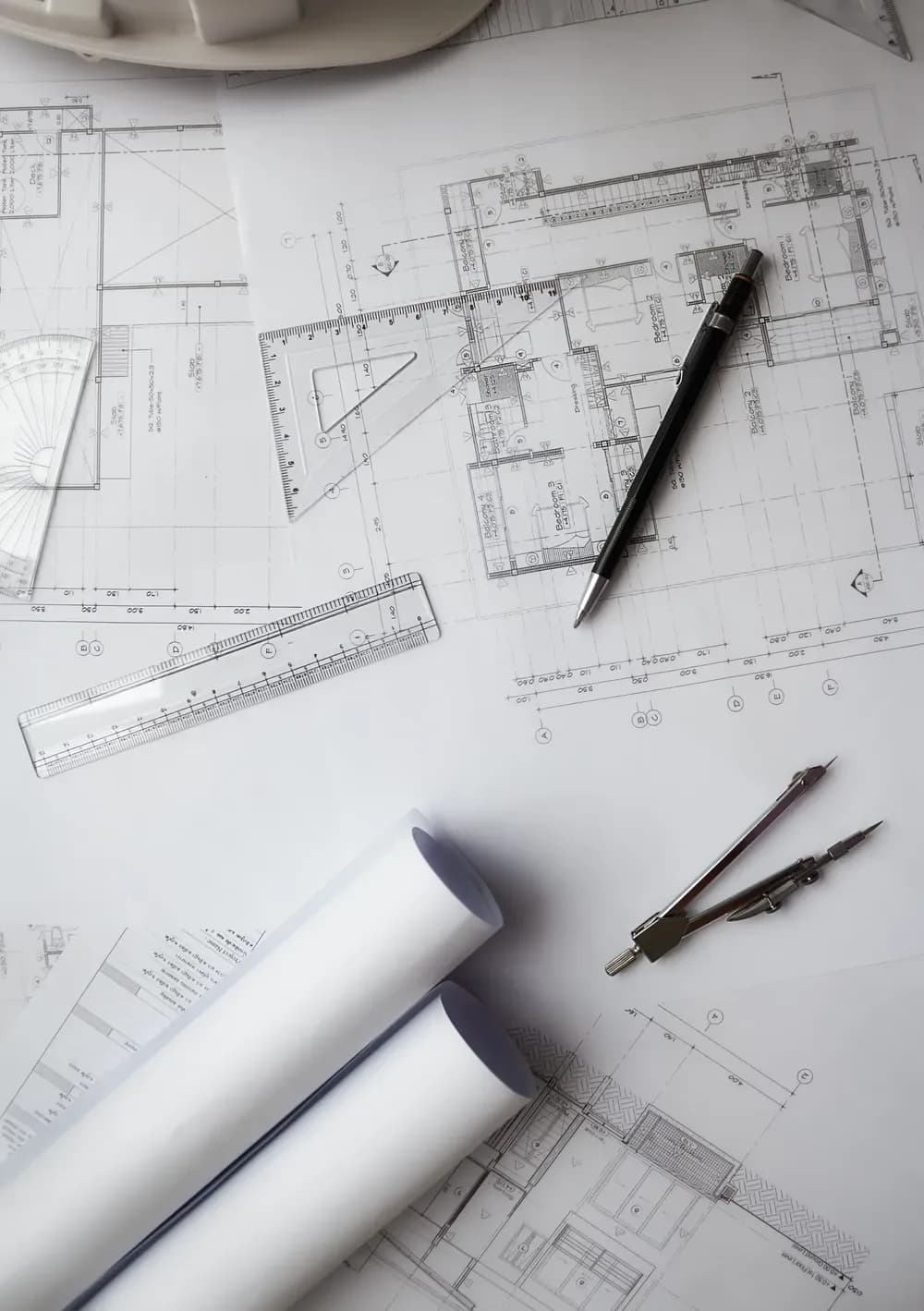 Architectural plans with drawing instruments