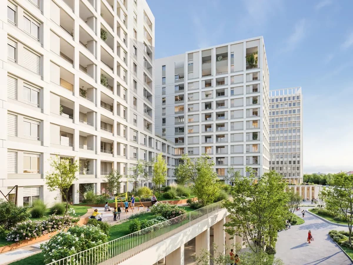 White residential towers with balconies against a blue sky