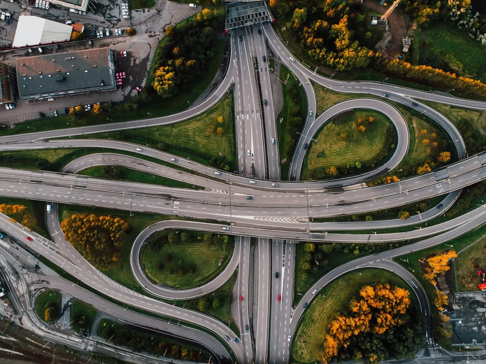 Aerial view of a highway interchange surrounded by trees